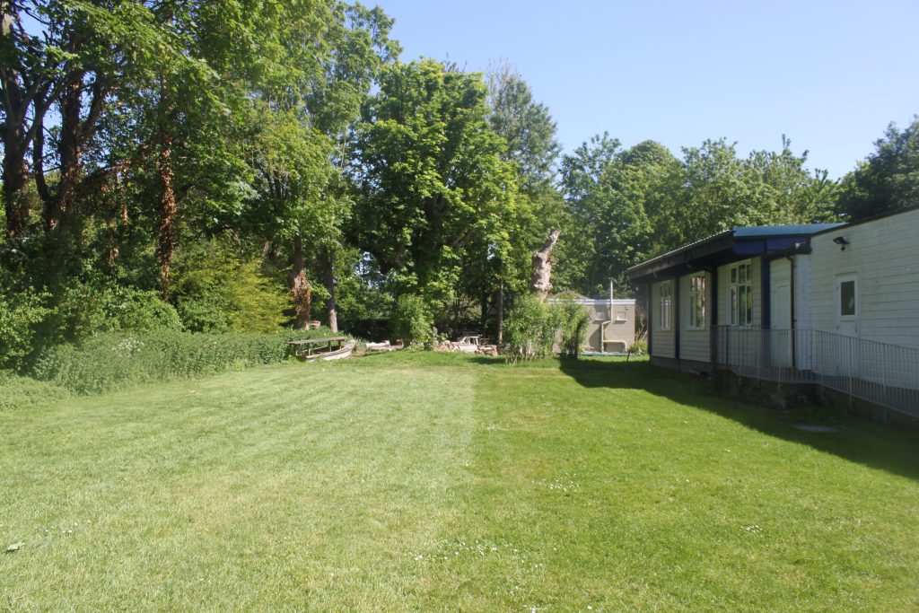 Paxmead grounds - large grassy area suitable for camping. Disabled ramp to toilet facilities.